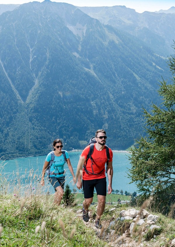 Hiking between lake and mountains